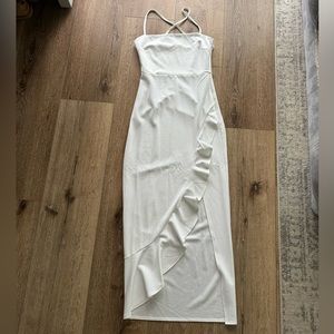 White maxi dress with ruffled slit